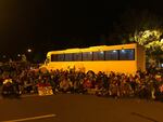 Protestors surround the ICE detention bus to sit down shortly before federal agents arrive.