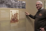 Retired teacher and Coos History Museum board member Steven Greif shows the Alonzo Tucker display. He says the museum plans to do more on civil rights in the future. 