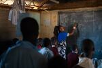 The third-grade teacher, Florence Lerapayo, teaches a math lesson. She says when Paris first arrived in her classroom he seemed uneasy and adrift.