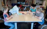 Elementary students Oaken, Espoire (bottom left, top left) work together with Tessa and Ara (bottom right, top right) to build towers with marshmallows and toothpicks during spring break at the Boys & Girls Club in Salem. The Boys & Girls Club is set to receive federal funds to expand its offerings.