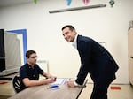 France's far-right National Rally President Jordan Bardella has his identity papers checked before voting for the European Parliament election at a polling station in Garches, suburb of Paris, on June 9.