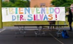 A colorful banner made by parents hangs on the playground for a meet and greet with the incoming Rigler Elementary School principal, Chris Silvas, May 28, 2021. The Northeast Portland school has seen several principals come and go, with the current principal at the school for eight months.