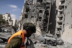 Israeli emergency services and security officers search for casualties in the rubble of a building hit by an Iranian missile in Beersheba in southern Israel on June 24, 2025. US President Donald Trump announced a phased 24-hour ceasefire process beginning at around 0400 GMT on June 24, which Israel said it had agreed to. Iran has not formally accepted a ceasefire. (Photo by John Wessels / AFP) (Photo by JOHN WESSELS/AFP via Getty Images)