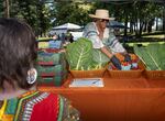 Ruthie Culver sets up a booth with free produce at the Juneteenth celebration. The food was sourced from local BIPOC food growers by local organization The Black Food Sovereignty Coalition.