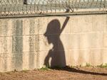 In this file photo, the shadow of a player on a high school JV girls softball team is pictured in this file photo.
