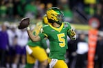 Oregon quarterback Dante Moore looks to pass the ball during the first half of the first round of the NCAA College Football Playoff against James Madison, Saturday, Dec. 20, 2025, in Eugene, Ore.