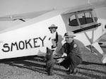 Smokey the bear cub is flown from Santa Fe, N.M., to his new home at the Washington National Zoo in a Piper J-3 Cub by New Mexico Assistant State Game Warden Homer C. Pickens in 1950. The little bear was rescued from a forest fire and named Smokey after the fire prevention symbol of the U.S. Forest Service.