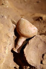 An ancient ceramic vessel was discovered in the tomb.