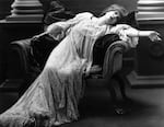 Stage actress Sarah Bernhardt (1844-1923) reclines in a scene from an unnamed theater production.
