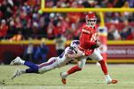 Patrick Mahomes #15 of the Kansas City Chiefs is sacked by Matt Milano #58 of the Buffalo Bills during the third quarter in the AFC Championship Game at GEHA Field at Arrowhead Stadium on Jan. 26 in Kansas City, Missouri.