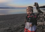 Matika Wilbur dedicates Project 562 to her daughter Alma Bee, who was one year old when this photo was taken. Alma Bee is standing along the coast of Washington State on traditional homelands of the Tulalip tribe, with Swinomish land in the background, both reflecting her ancestry.