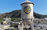 In an aerial view, the Warner Bros. logo is displayed on the water tower at Warner Bros. Studio last month in Burbank, Calif.