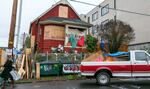 Activists at the "red house" put out a call on Sunday morning, Dec. 13, 2020, asking for help to remove barricades after it was announced that city had reached a tentative deal with the owners of the home.