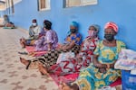 People in protective masks wait in the corridor of a hospital in Bunia, Congo, Tuesday, May 19, 2026.