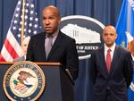 Under Secretary of the Treasury for Terrorism and Financial Intelligence Brian Nelson, with U.S. Attorney Matthew Graves for the District of Columbia, speaks during a news conference on Tuesday at the Department of Justice in Washington.