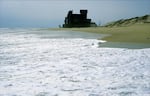 Rodanthe, Hatteras Island, North Carolina, 2004. The house is now at the edge of the surf, the dune having been completely washed away by storms, increased wave action and sea level rise. The area is losing 12 feet each year on average.