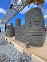 A structure printed with concrete and a 3D printer by manufacturer Alquist.