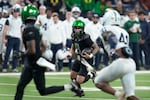 Oregon quarterback Dillon Gabriel (8) runs up field during the first half of the Big Ten championship NCAA college football game against Penn State, Saturday, Dec. 7, 2024, in Indianapolis.