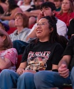 Christie Tuttle watches the jumbotron, wearing a shirt for Portland Fire center Megan Gustafson’s corgi, Pancake at the Moda Center in Portland, Ore., on July 9, 2026. Gustafson's corgi, Pancake, has become famous among Portland Fire fans.