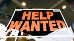 A sign says "help wanted"