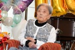 This photo provided by Ashiya City shows Tomiko Itooka, being celebrated for her 116th birthday at the nursing home she lives in Ashiya, western Japan, on May 23, 2024.