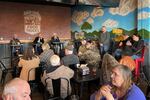 A community member (right) speaks during a recent Coos Bay town hall meeting at a local restaurant.