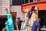 Workers place sheets of wood over windows and glass doors to protect them from the strong winds expected with the arrival of Hurricane Milton in the hotel zone of Cancun, Quintana Roo State, Mexico, on Monday. Hurricane Milton exploded in strength Monday to become a potentially catastrophic Category 5 storm bound for Florida, the second ferocious storm to hit the region in as many weeks.