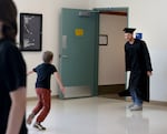 A child runs toward Garret Bergquist at the at the Deer Ridge Correctional Institution in Madras, Ore., on June 9, 2026.