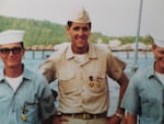 John Kerry (center) stands with other military personnel in an unspecified location circa the 1960s. The details of Kerry's service during the Vietnam War, and his subsequent anti-war activism, became the focus of a veterans' group's smear campaign against him during his 2004 presidential campaign.