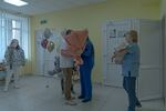 Ihor Kachaniuk, 24, meets his wife Victoria Kachaniuk, 29, after the birth of their son Kim at the Sloviansk City Clinical Hospital.