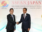 Japan's Prime Minister Fumio Kishida, left, greets Indonesia's President Joko Widodo upon arrival for the opening session of ASEAN-Japan Commemorative Summit Meeting at the Hotel Okura Tokyo in Tokyo Sunday, Dec. 17, 2023.