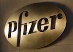 In this Monday, Nov. 23, 2015, file photo, the Pfizer logo is displayed at world headquarters in New York. On Monday, Nov. 9, 2020, Pfizer said an early peek at its vaccine data suggests the shots may be 90% effective at preventing COVID-19.