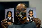 Sheldon Smith, center, holds the photographs of his children Deshawn Smith, 11, left, and Trinitee Smith, 13, both suffering from sickle cell anemia, during an Initiative 65 rally in Ridgeland, Miss. Smith and his wife Keishawna Smith believe their children would benefit from medical marijuana treatment for pain management. Initiative 65 would amend the Mississippi Constitution to allow the prescription by a doctor of up to 5 ounces (142 grams) of marijuana per month for people who suffer from more than 20 medical conditions. 