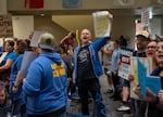 Sam Ellingson, who is the a second grade parent at James John Elementary and the Parent Teacher Association president, chants before a Portland Public Schools board meeting inside the Dr. Matthew Prophet Education Center, Oct. 6, 2026 in Portland, Ore.