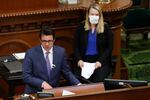 Legislative Analyst Gabriel Petek, left, discusses Gov. Gavin Newsom's proposed 2020-21 revised state budget during a hearing the state Capitol in Sacramento, Calif., May 26, 2020. On Thursday, Dec. 7, 2023, Petek said California is facing a $68 billion budget deficit.