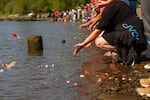 Concluding the Mayan Water Ceremony, attendees were encouraged to make an offering of their own to the river.