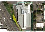 A blue line shows the rough boundaries of Portland Public Schools' property, with Harriet Tubman Middle School in the center. A yellow shaded area shows the approximate portion of the property ODOT would take as part of the freeway-widening project.