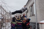 A boy is tossed into the air during the celebration of Malanka, a Ukrainian folk holiday with Christian-pagan roots, in Vălcineț, Ocnița district, Moldova, Jan. 13. Ukrainian is still widely spoken in Vălcineț.