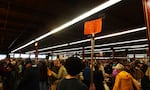 Crowds of people sift through books during the Powell's Books Warehouse Sale in Portland.