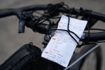Handwritten directions are taped to Portland Bureau of Transportation employee Sarah Goforth’s bike handlebars.