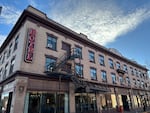 This photo shows a three-story hotel in Kalispell, Montana, that's made of light brown bricks.