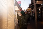 Joel Hernandez loads pan dulce onto a rack at the Día de Muertos celebration in Bend, Ore., on Nov. 7, 2025.
