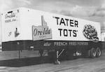 A black-and-white image of an Ore-Ida Foods tractor trailer with the company logo and the word "Tater Tots" on the side.