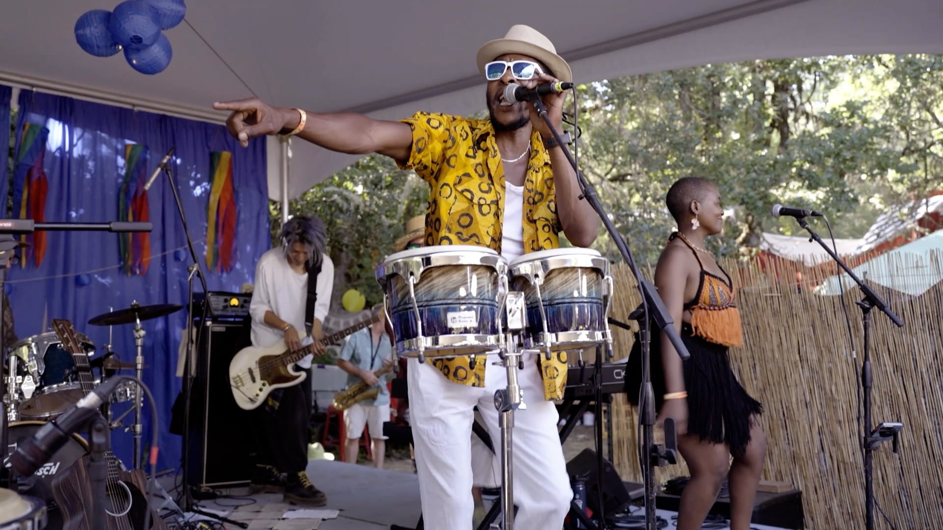 Singer songwriter John Mambira performs at Oregon Country Fair in Veneta, Ore., on July 12, 2024.