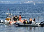 Dive and recovery teams search for a final missing person off Porticello harbor near Palermo on Aug. 22, three days after the British-flagged luxury yacht Bayesian sank.