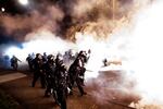 Police use chemical irritants and crowd control munitions to disperse protesters during a demonstration in Portland, Ore., Saturday, Sept. 5, 2020. Hundreds of people gathered for rallies and marches against police violence and racial injustice Saturday night in Portland, Oregon, as often violent nightly demonstrations that have happened for 100 days since George Floyd was killed showed no signs of ceasing.