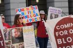 People rally outside a courthouse while a hearing for Purdue Pharma takes place inside in Newark, N.J., Tuesday, April 21, 2026.