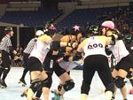 The London Rollergirls jammer (in black, with pink star on helmet) attempts to break through the Arch Rival Roller Derby blockers at Veterans Memorial Coliseum, during the WFTDA championships.