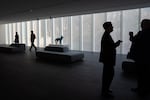 People walk through a new gallery space at the Portland Art Museum in Portland, Ore., Thursday, Nov. 20, 2025. The museum's new $111 million addition connects the former Masonic Temple built in 1927 and the 1932 original museum complex by Pietro Belluschi.