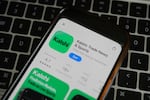FILE - An ad for the prediction market app Kalshi is displayed on a mobile phone Thursday, April 16, 2026, in Chicago.